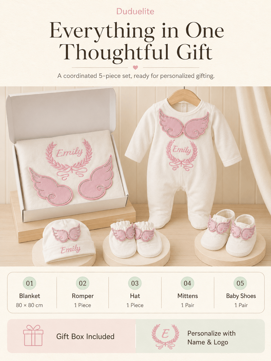 Pink personalized baby gift set with embroidered name and coordinated newborn essentials